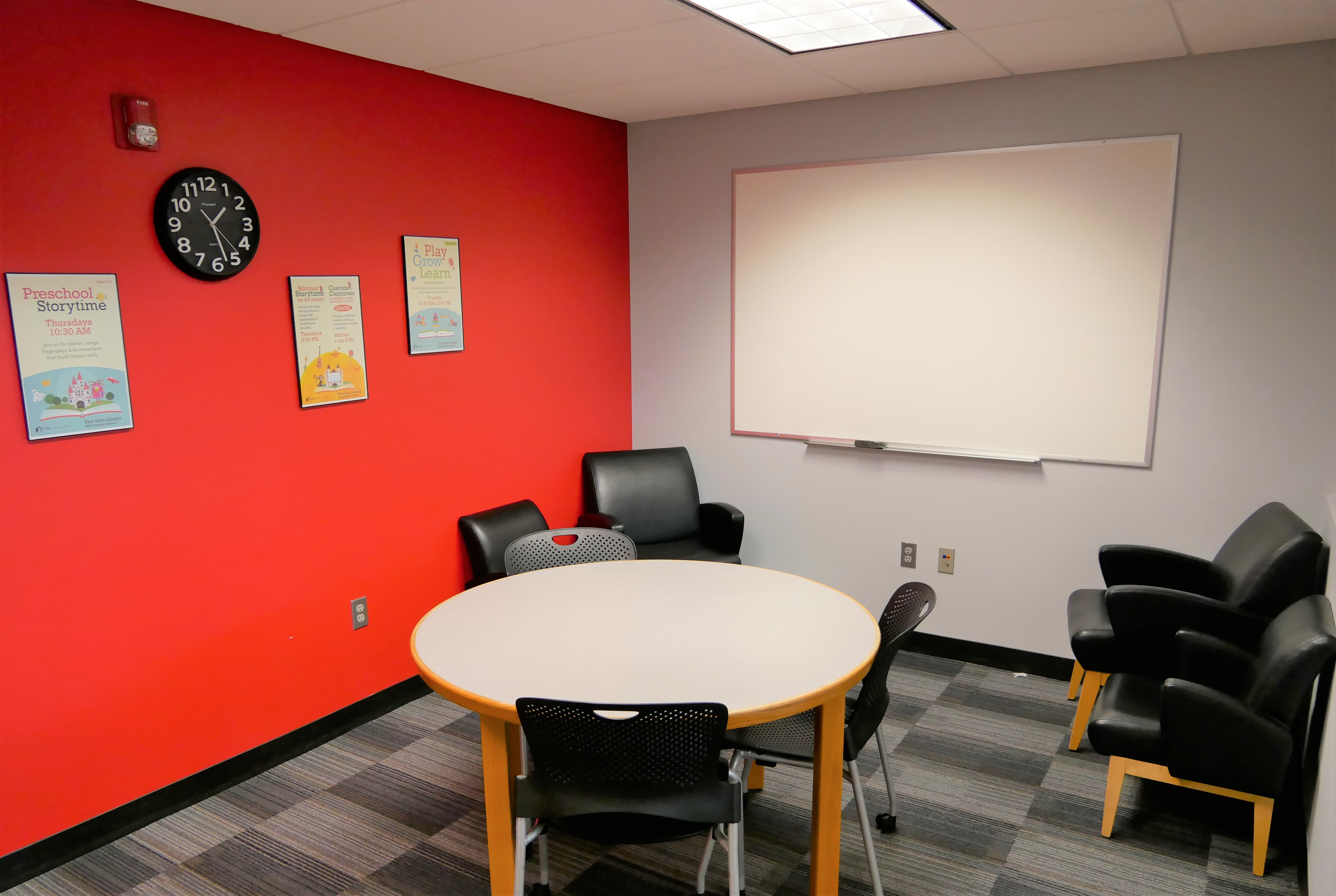 Large Study Room with circular table, chairs, and whiteboard