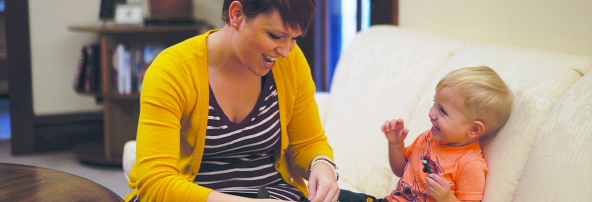 Mother and young son singing together