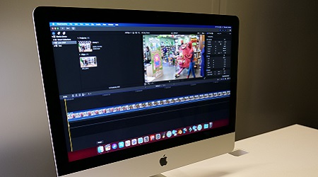 Mac computer monitor with video editing software on screen