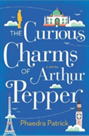 blue book cover with title The Curious Charms of Arthur Pepper