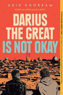 two teen boys in jackets looking down over a sprawling cityscape with the title "Darius the Great is Not Okay"