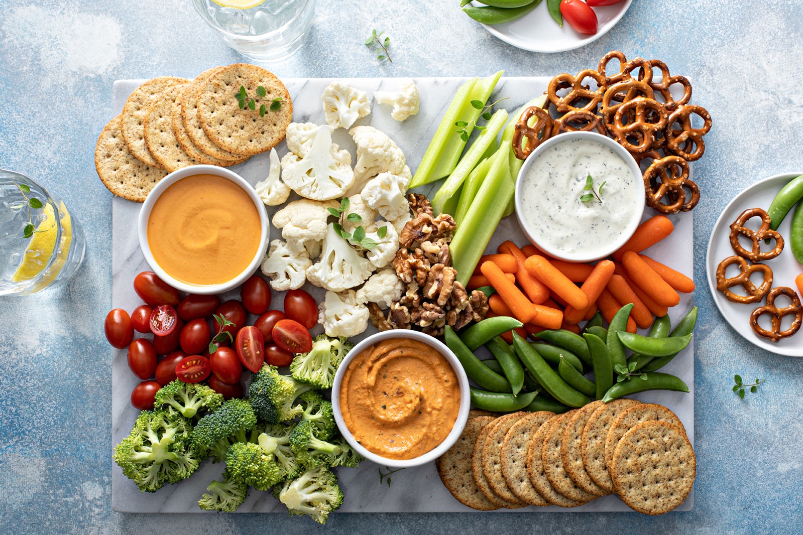 plant-based snack board with vegetables and crackers