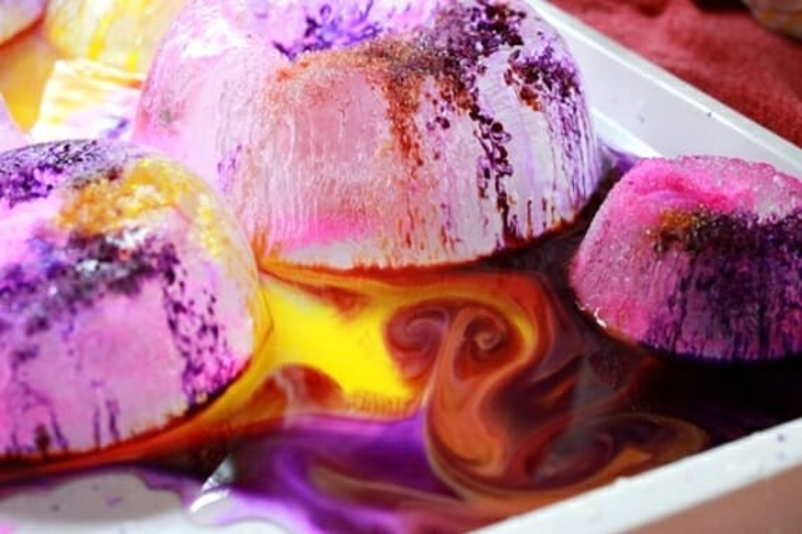 large ice cubes swirled with purple and yellow