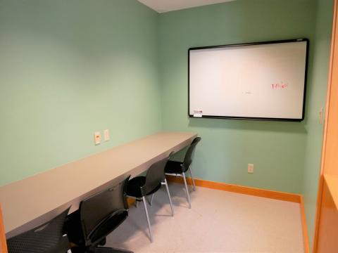 North Side Study Room 2 with whiteboard, table and chairs