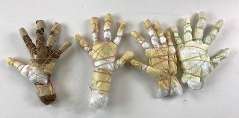 picture of hand scultptures made out of recycled materials