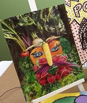 picture of an art project that is a collage of a face made out of food