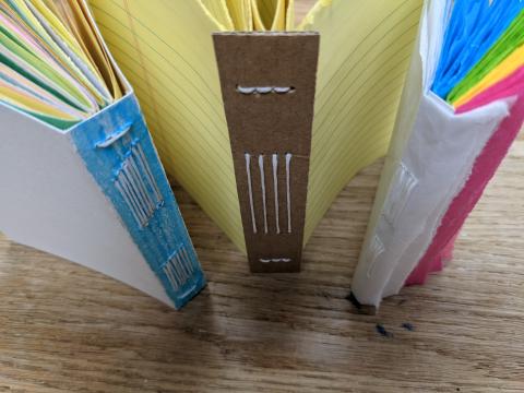 three books made with long stitch binding