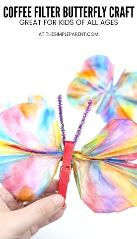 An image of a butterfly made by coloring a coffee filter and pinching the middle with a clothespin