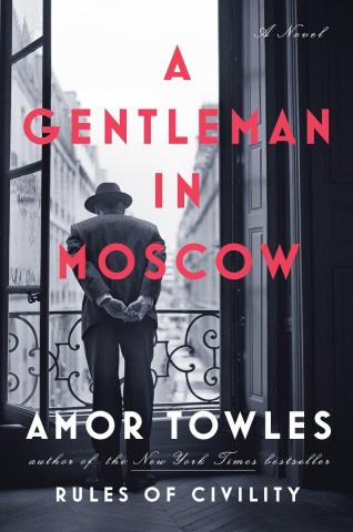 Book cover for "A Gentleman in Moscow" by Amor Towles, featuring a man in a hat standing on a balcony overlooking a city street.