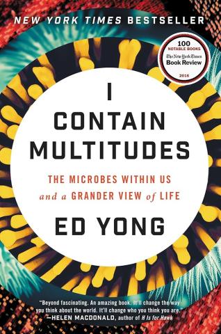 Book cover for I Contain Multitudes with a white circle surrounded by rings of different colored microbial organisms.