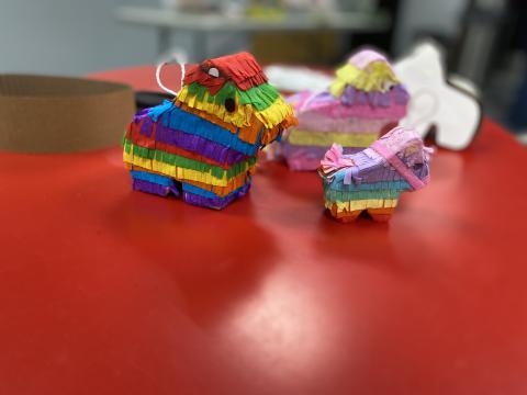A photo of three mini pinatas