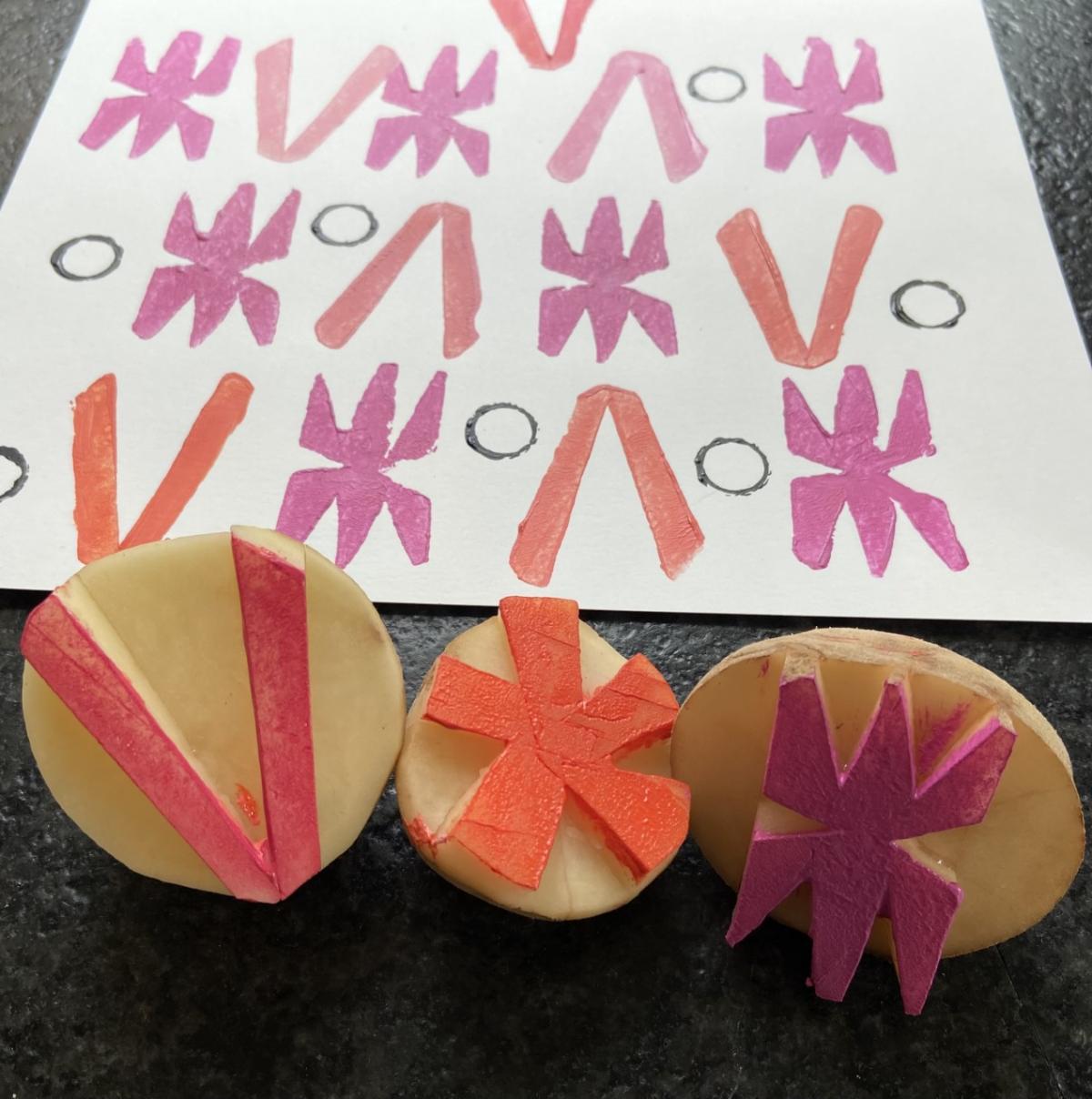 Three cut potatoes with colorful imprint