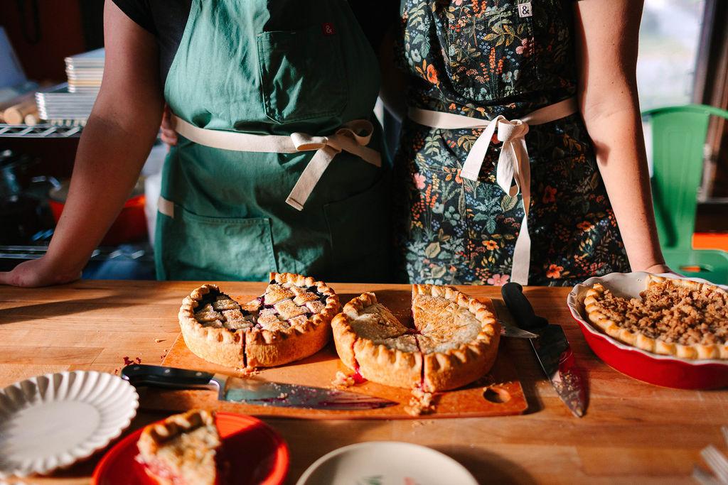 people standing in front of pie